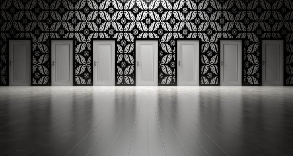 7 doors in a hallway to choose from