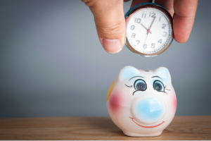 clock being added to cute pig bank