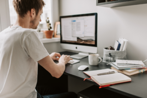 man working from home on computer